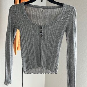 This is a newer , fitted shirt from Aeropostale. It’s on the shorter side.